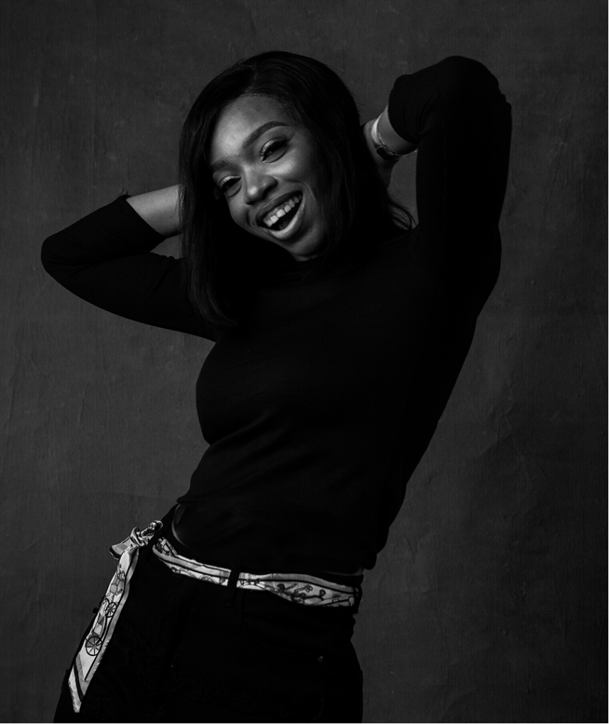 cindy way casually holding her head, swinging her hips